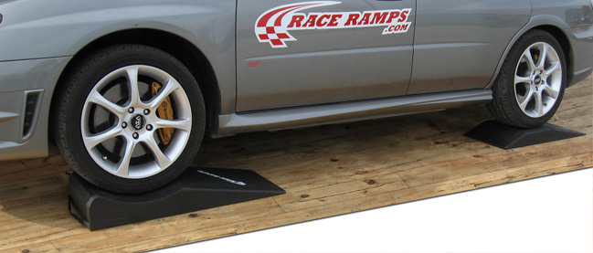 Silver STI Subaru race ramps trailer assist